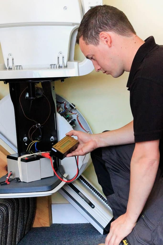Stairlift Engineer Servicing a Stairlift